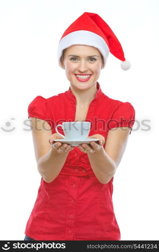 Happy woman in Christmas hat holding cup of hot beverage