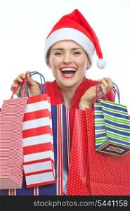 Happy woman in Christmas hat with shopping bags