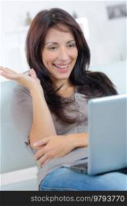 happy woman in front of her computer