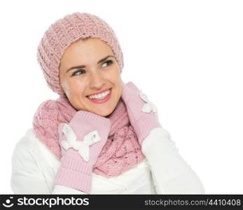 Happy woman in knit winter clothing looking on copy space