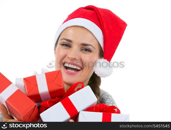 Happy woman in Santa hat with Christmas gift boxes