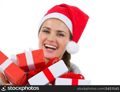 Happy woman in Santa hat with Christmas gift boxes