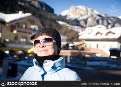 Happy Woman In Small Italian Alps Village. Winter Travel Series.