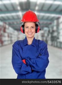 Happy woman industrial worker in the workplace