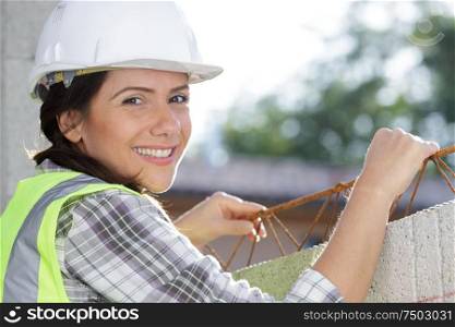 happy woman is a construction worker