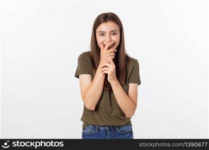 Happy woman laughing covering her mouth with a hands isolate over grey background. Happy woman laughing covering her mouth with a hands isolate over grey background.