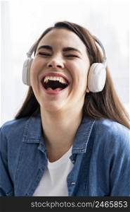 happy woman laughing listening music headphones