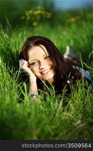 happy woman lay on green grass