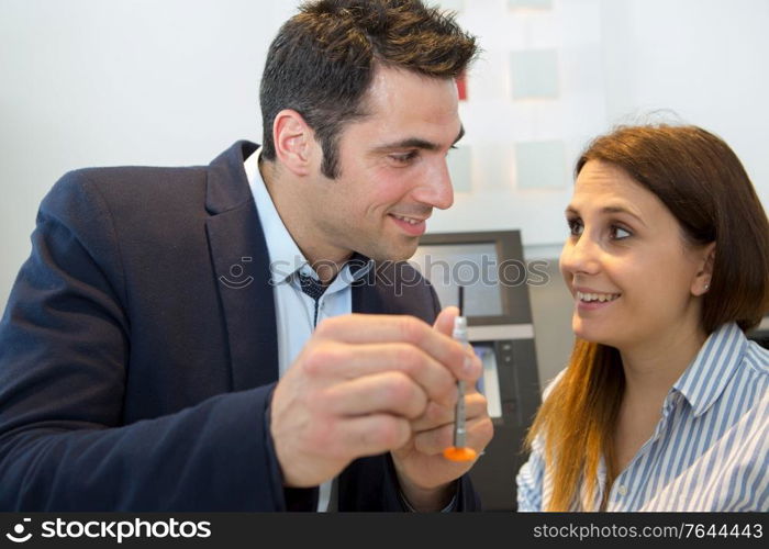 happy woman looking at screwdriver