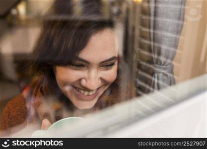 happy woman looking window