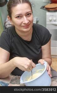 happy woman making cake