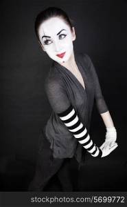 Happy woman mime on a black background