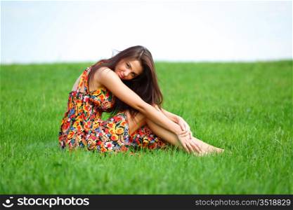 happy woman on green grass