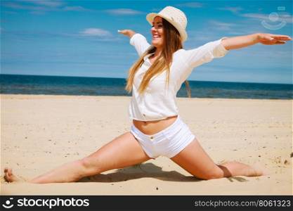 Happy woman on summer beach.. Happiness and craziness. Smiling crazy girl have fun outdoor. Young attractive long haired woman playing on summer beach.