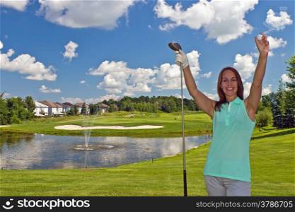 Happy woman on the faireway of a golf course