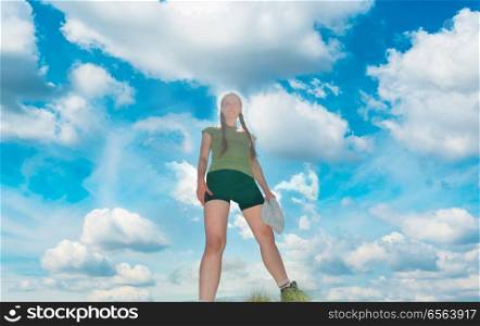Happy woman on the top with blue sky. Happy woman on the top with blue sky and clouds