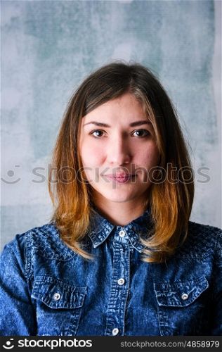 Happy woman portrait. Portrait of young adult happy woman against grunge wall