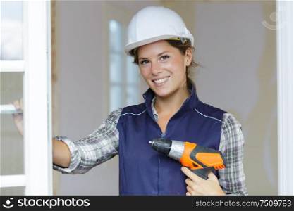 happy woman power tools for work at home