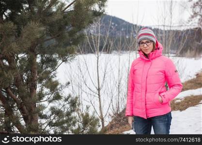 Happy woman relaxing on the top of mountain at beauty sunny spring day, in Altai mountains. Travel vacation concept.. Happy woman relaxing on the top of mountain