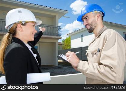 happy woman showing customer the new apartment