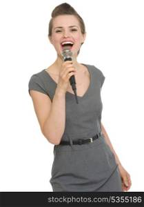 Happy woman singing in microphone. HQ photo. Not oversharpened. Not oversaturated. Happy woman singing in microphone isolated