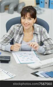 happy woman sitting in her office