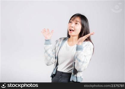 Happy woman surprised excited screaming open mouth say wow show hand, Asian beautiful young female smile winner successful, studio shot isolated on white background with copy space
