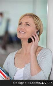 Happy woman talking on her mobile phone