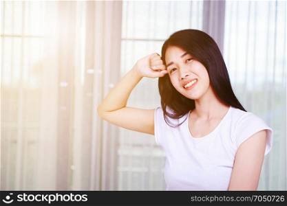 happy woman thinking with window background at home