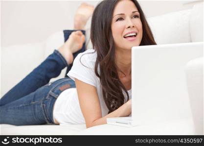 Happy Woman Using Laptop Computer