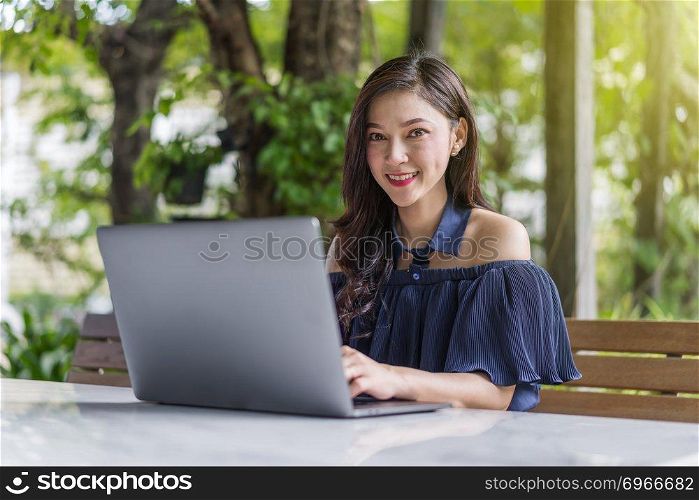 happy woman using laptop computer