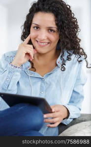 happy woman using tablet at home