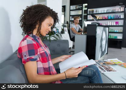 happy woman waiting for a treatment at a beauty salon