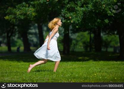 Happy woman wearing white dress hurrying jumping up