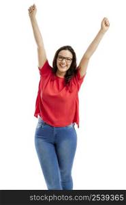 Happy woman with arms up, isolated over white background
