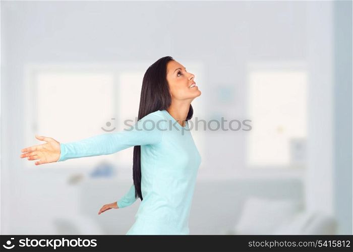 Happy Woman with Arms Wide Open in her house