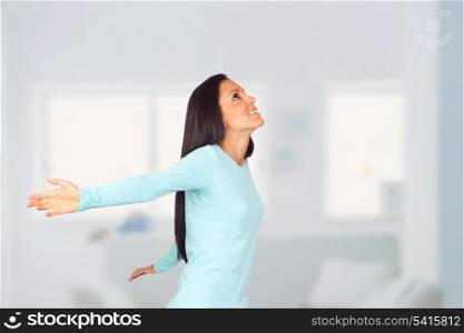 Happy Woman with Arms Wide Open in her house