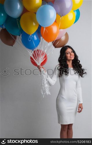 Happy woman with balloons. Happy woman with many colorful balloons