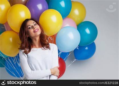 Happy woman with balloons. Happy woman with many colorful balloons