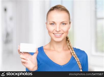 happy woman with business card in office