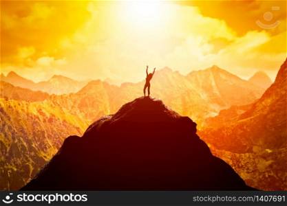 Happy woman with hands up on the peak of the mountain enjoying the success, freedom and bright future.. Happy woman on peak of the mountain enjoying the success, freedom and bright future.