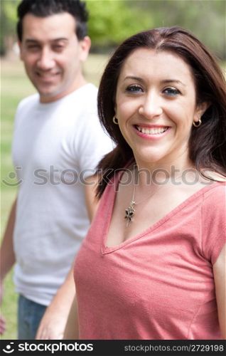 Happy woman with her boyfriend in the park