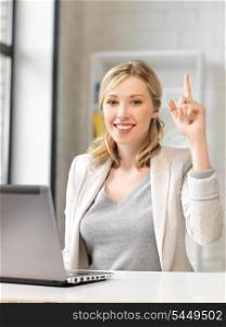 happy woman with laptop computer and finger up