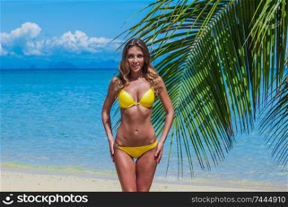 Happy woman with on beach with palms in Thailand. Happy woman on beach