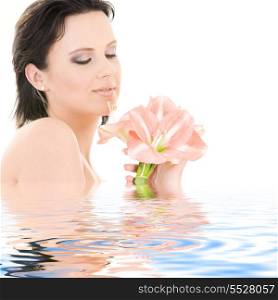 happy woman with pink madonna lily flowers in water