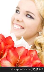 happy woman with red and white lily flowers