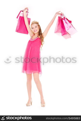 happy woman with shopping bags over white