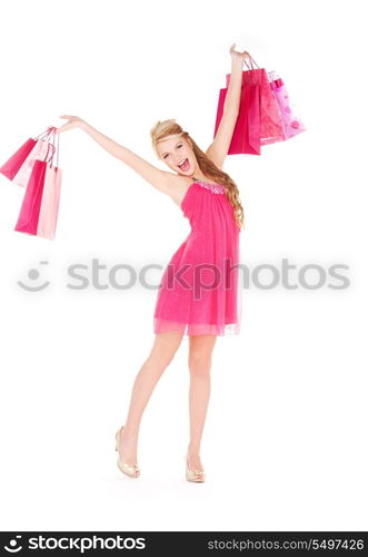 happy woman with shopping bags over white