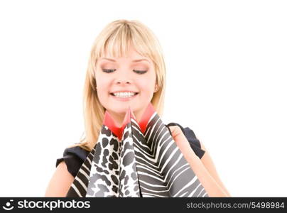 happy woman with shopping bags over white