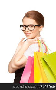 happy woman with shopping bags over white&#xA;